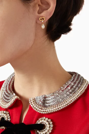 أقراط بتصميم بيضاوي مرصعة بكريستال سواروفسكي معدن