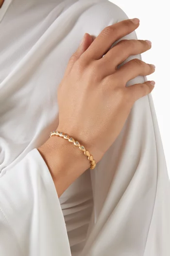 سوار مرصع بأحجار بلون فيروزي ذهب أصفر مصقول عيار 18