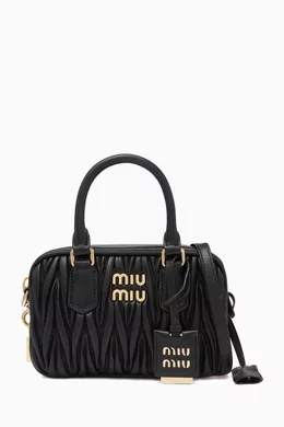 Buy Miu Miu Black Small Matelassé Top Handle Bag in Leather for