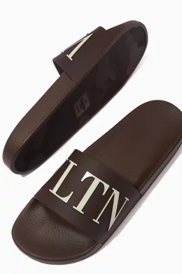 Buy Valentino Garavani Color Valentino Garavani VLTN Slide Sandals in Rubber Online for Men Ounass Oman