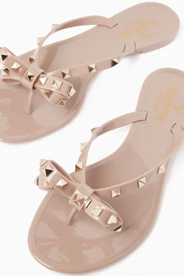 Buy Valentino Garavani Neutral Valentino Garavani Rockstud Flip Flops in PVC Online for Women Ounass Oman