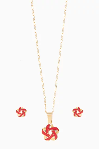 طقم ذهب مزين بزهرة بتصميم هندسي