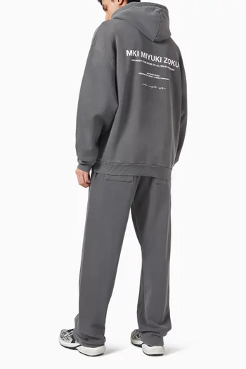 كنزة بغطاء رأس وشعار الماركة وعبارة Design Studio مزيج قطن