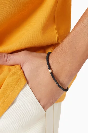 سوار خرز بتصميم مسبحة وحلية عين حسود عقيق وياقوت وذهب أصفر عيار 18