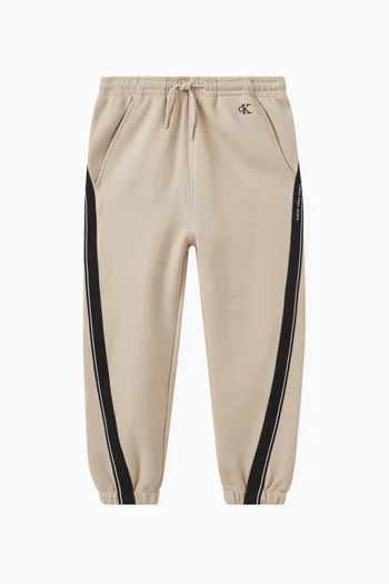 Relaxed Logo-tape Sweatpants in Cotton-piqué Blend