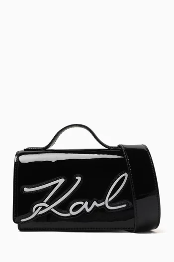 K/Signature Top-handle Bag in Patent Faux Leather
