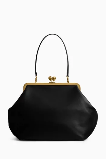 حقيبة كبيرة بقفل متقاطع وإطار جلد