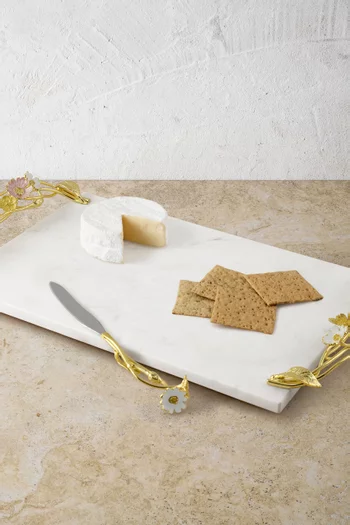 لوح تقطيع الجبن وسكين مزين بنباتات برية