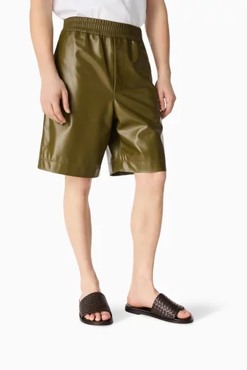 Elio Mules in Intrecciato Leather