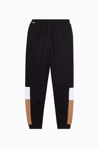 بنطال رياضي بتصميم مقسم بألوان وشعار الماركة صوف