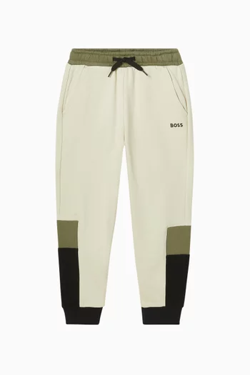 بنطال رياضي بتصميم مقسم بألوان وشعار الماركة صوف