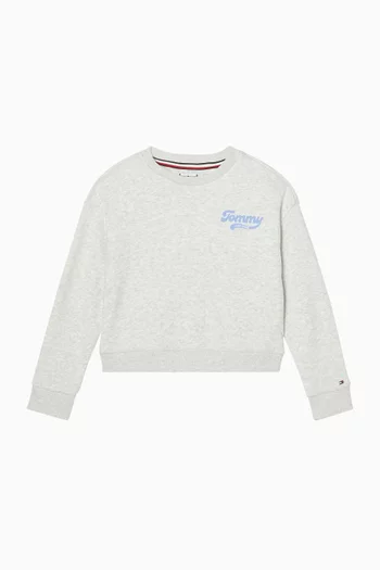 سويت شيرت بقصة فضفاضة وشعار الماركة بتصميم جامعي وبارز الملمس