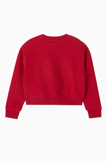 سويت شيرت بقصة فضفاضة وشعار الماركة بتصميم جامعي وبارز الملمس