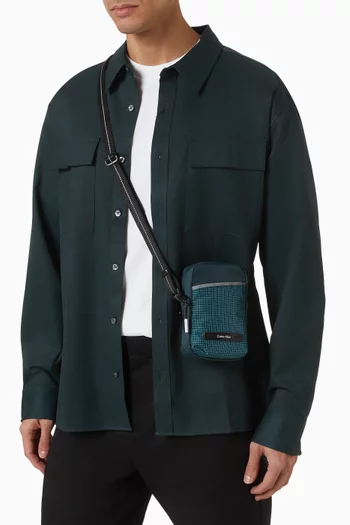 حقيبة ريبورتر بتصميم رفيع بخطوط وسحّاب نايلون