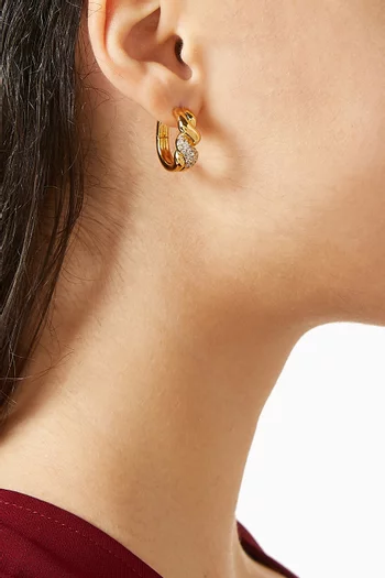 أقراط دائرية مولتن سنو بتصميم ملفوف