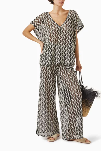 بنطال ييرا واسع الساقين بنقشة خطوط متعرجة