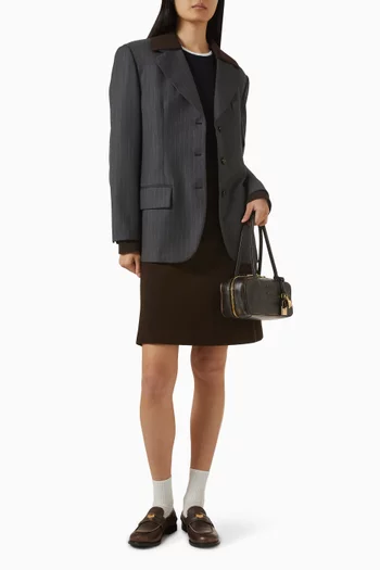 جاكيت بصف أزرار واحد ومخطط