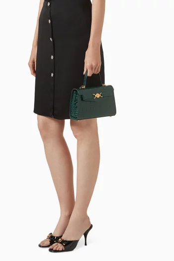 حقيبة صغيرة بيد علوية وشعار ميدوسا 95' جلد بنقشة جلد التمساح