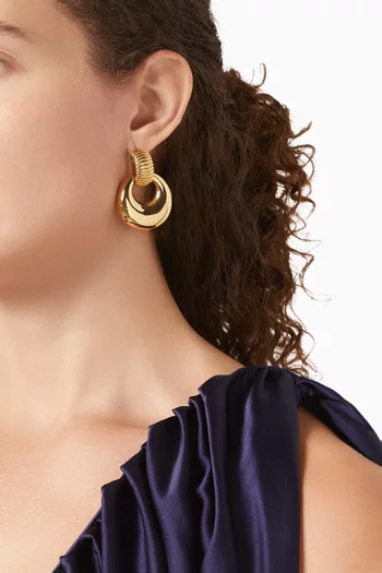 أقراط بتصميم حلقة الباب بمشبك من الثمانينيات