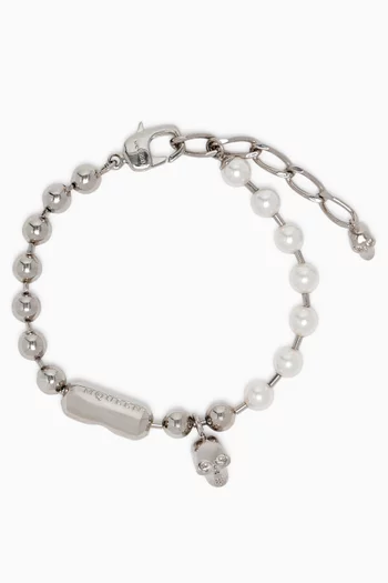 سوار بلؤلؤ وحلية جمجمة نحاس