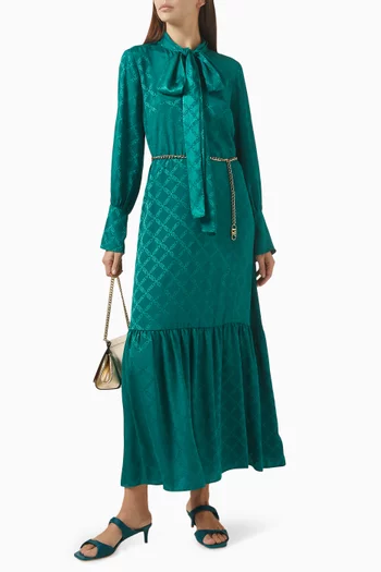 فستان طويل بعقدة ونقشة شعار الماركة جاكار