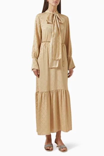 فستان طويل بعقدة ونقشة شعار الماركة جاكار