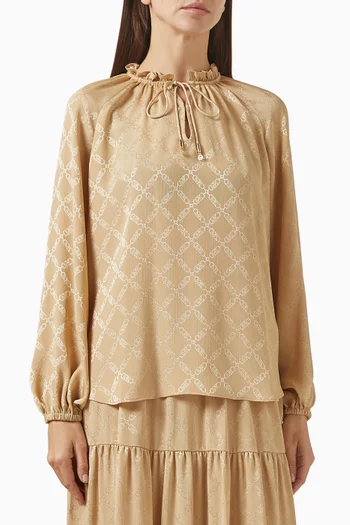 بلوزة بنقشة شعار الماركة