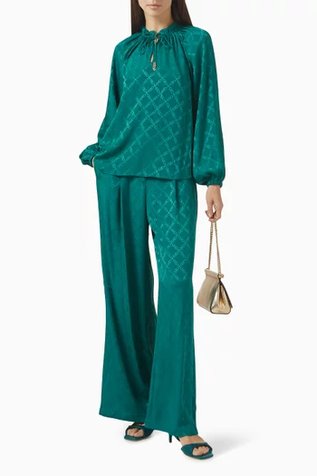 بلوزة بأكمام رغلان ونقشة شعار الماركة جاكار