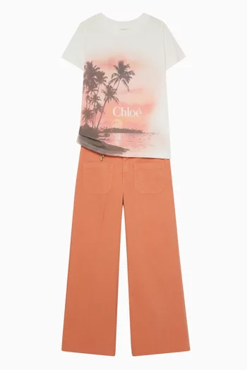 تي شيرت بطبعة شاطئ وشعار الماركة قطن