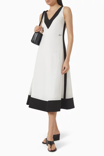 فستان متوسط الطول باللونين الأبيض والأسود مزيج كتان