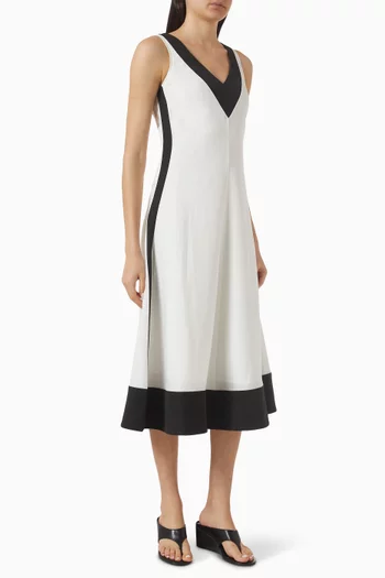 فستان متوسط الطول باللونين الأبيض والأسود مزيج كتان