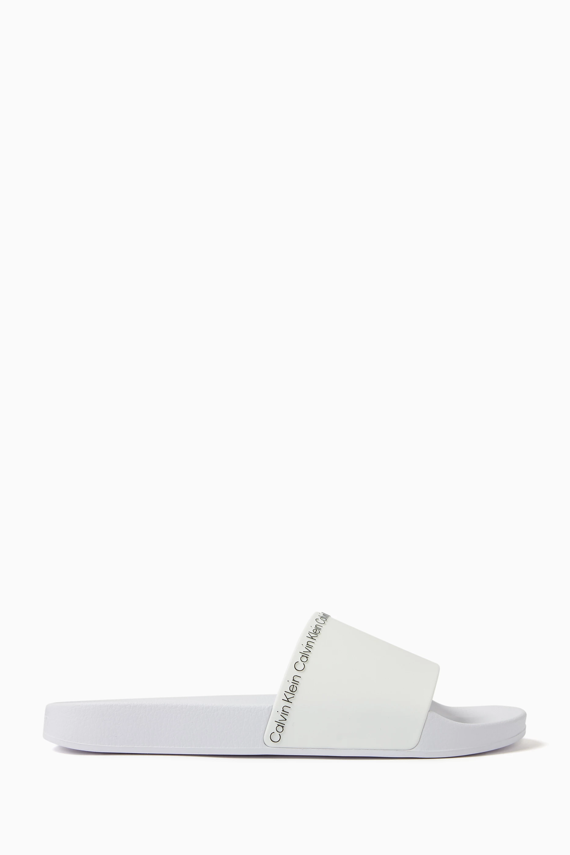 Buy Calvin Klein White Logo Pool Slides in Rubber For Men Online Ounass Oman