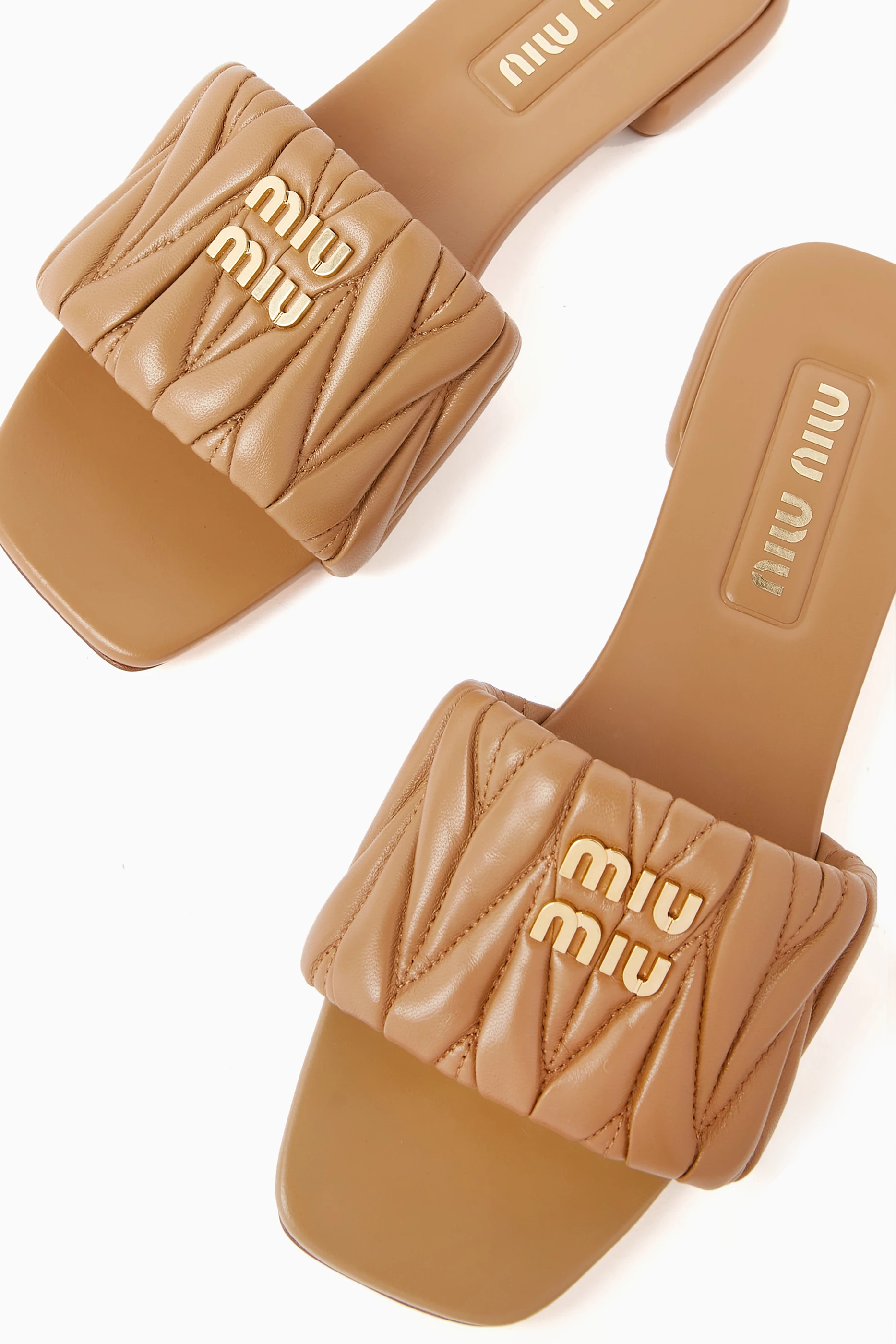 Buy Miu Miu Brown Logo Slides in Matelasse Nappa For Women Online Ounass Oman