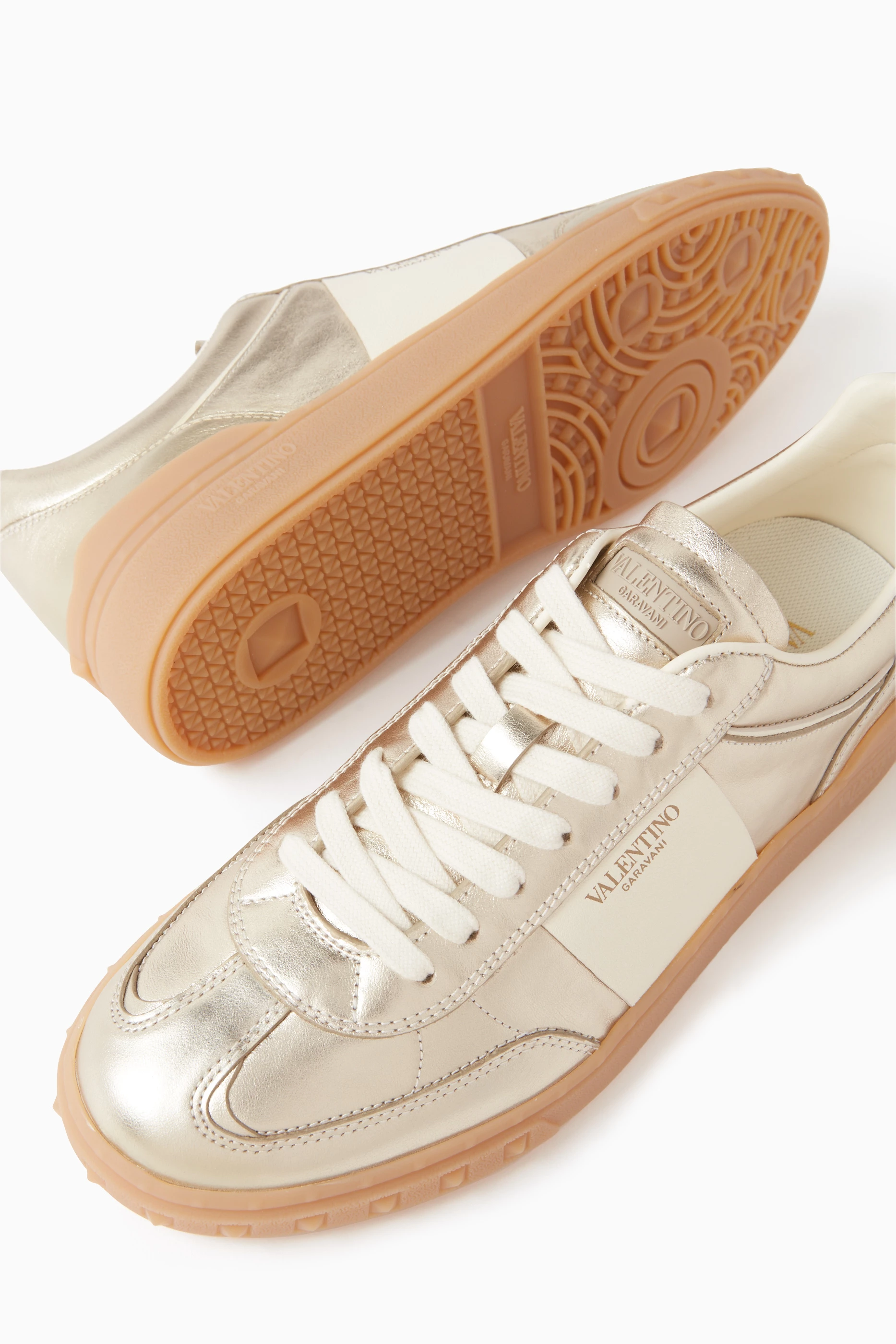 Buy Valentino Garavani Gold Valentino Garavani Upvillage Sneakers in Laminated Calfskin Leather For Women Online Ounass Oman
